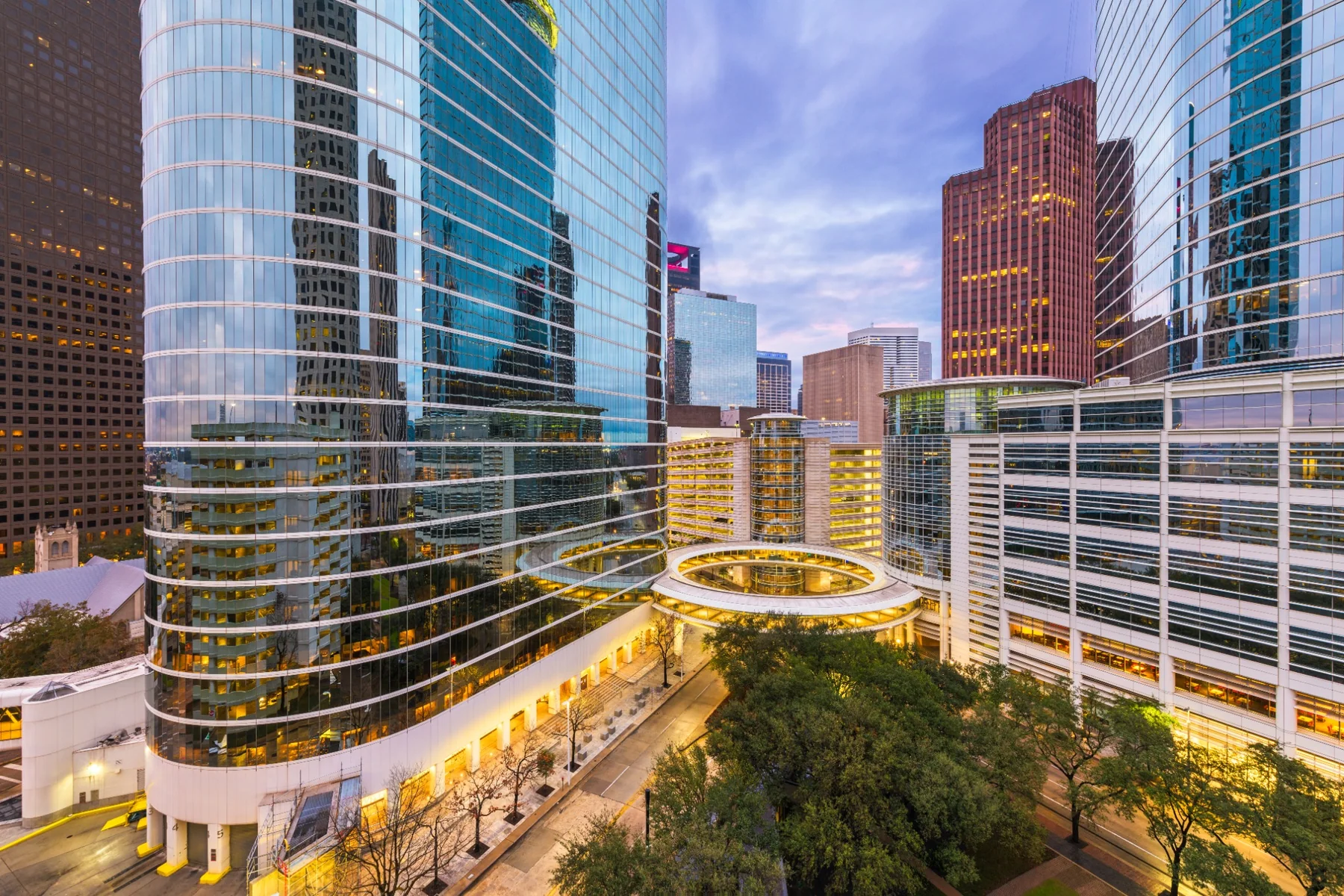 Downtown Houston office buildings illuminated at dusk