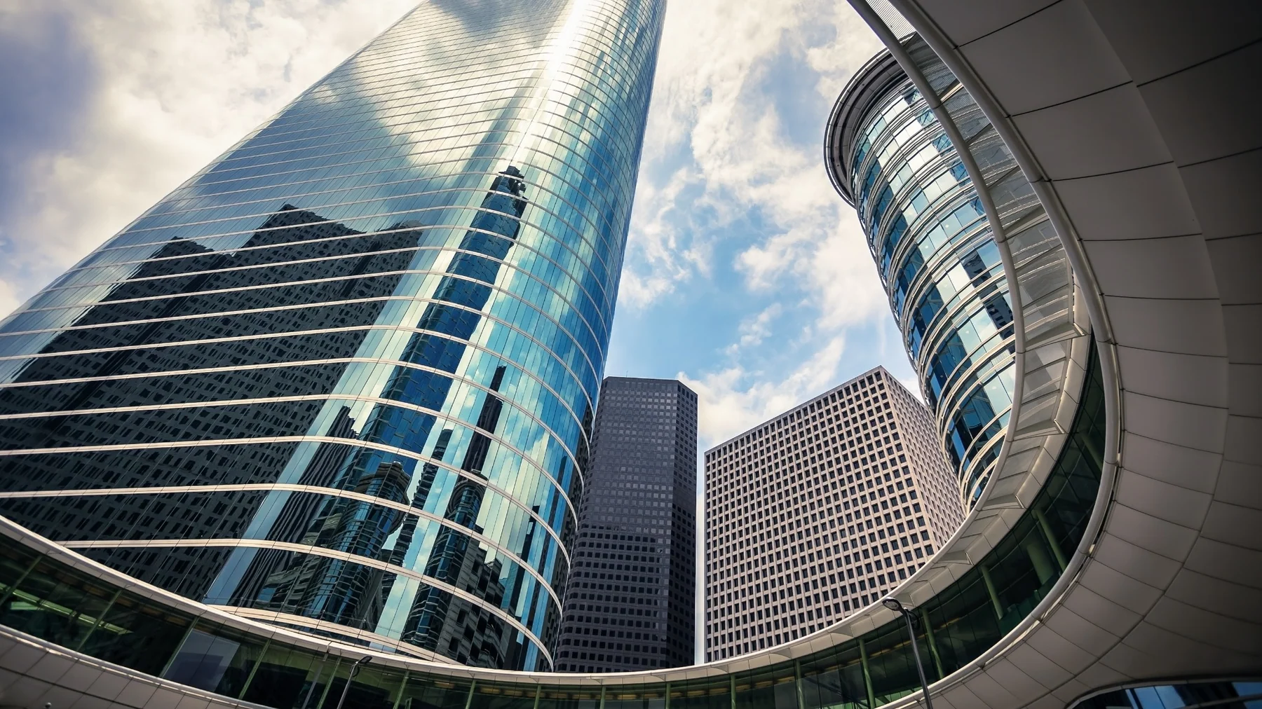 Modern glass commercial office buildings viewed from below